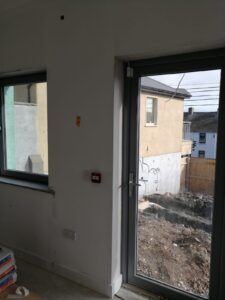 Installation of windows and a door at the entrance of the new Wexford Rape Crisis Building