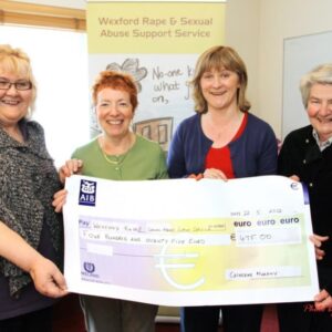Group of people from the Wexford Rape Crisis Holding a Cheque of 475 euro