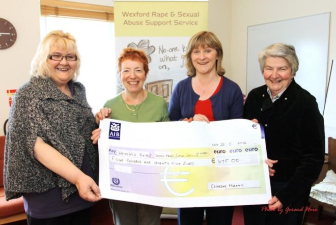 Group of people from the Wexford Rape Crisis Holding a Cheque of 475 euro