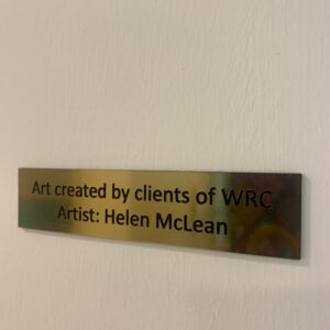 Plaque that says Art created by clients of WRC Artist: Helen McLean